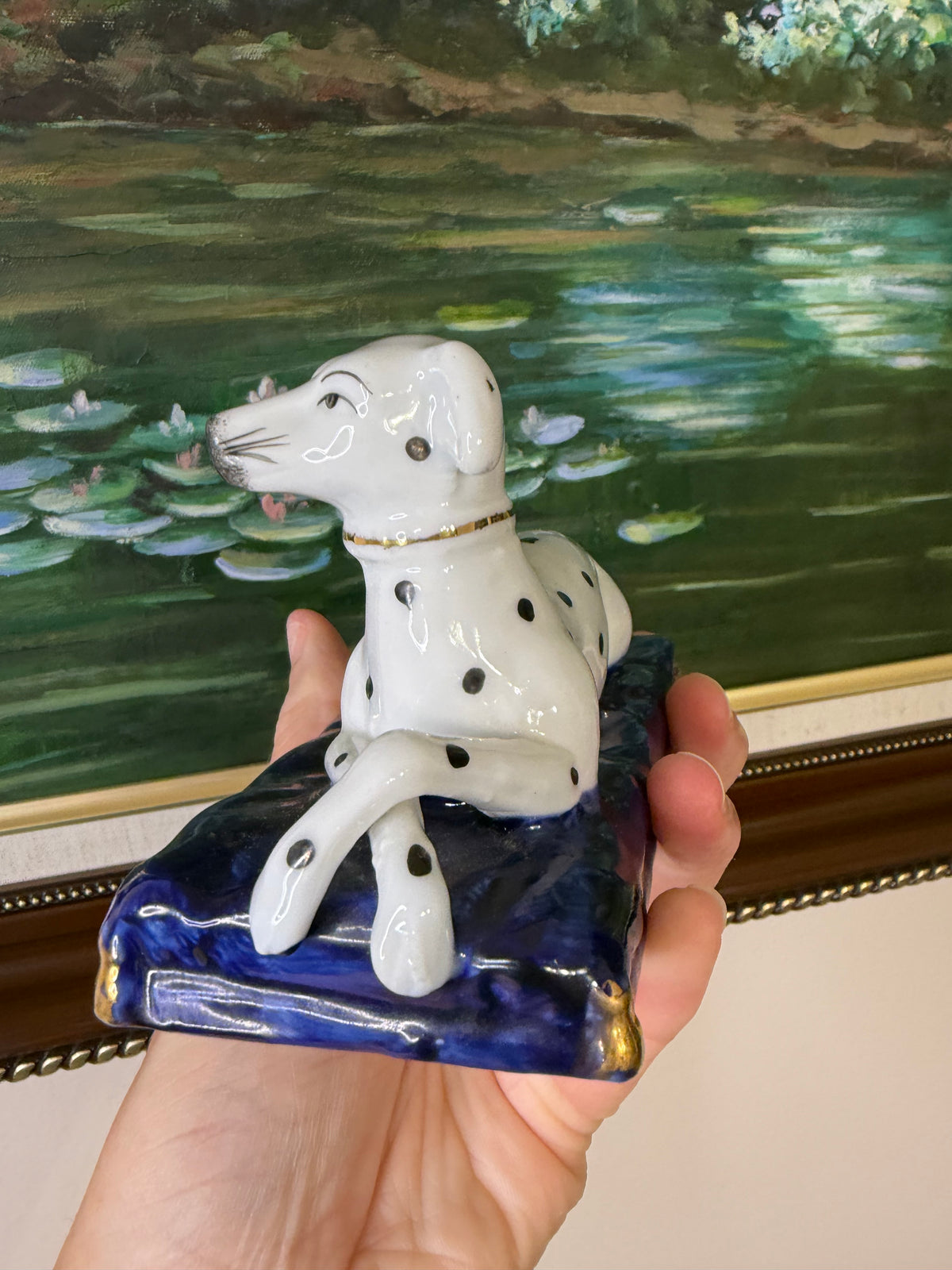 Sweetest Dalmatian dog with crossed paws on cobalt pillow!