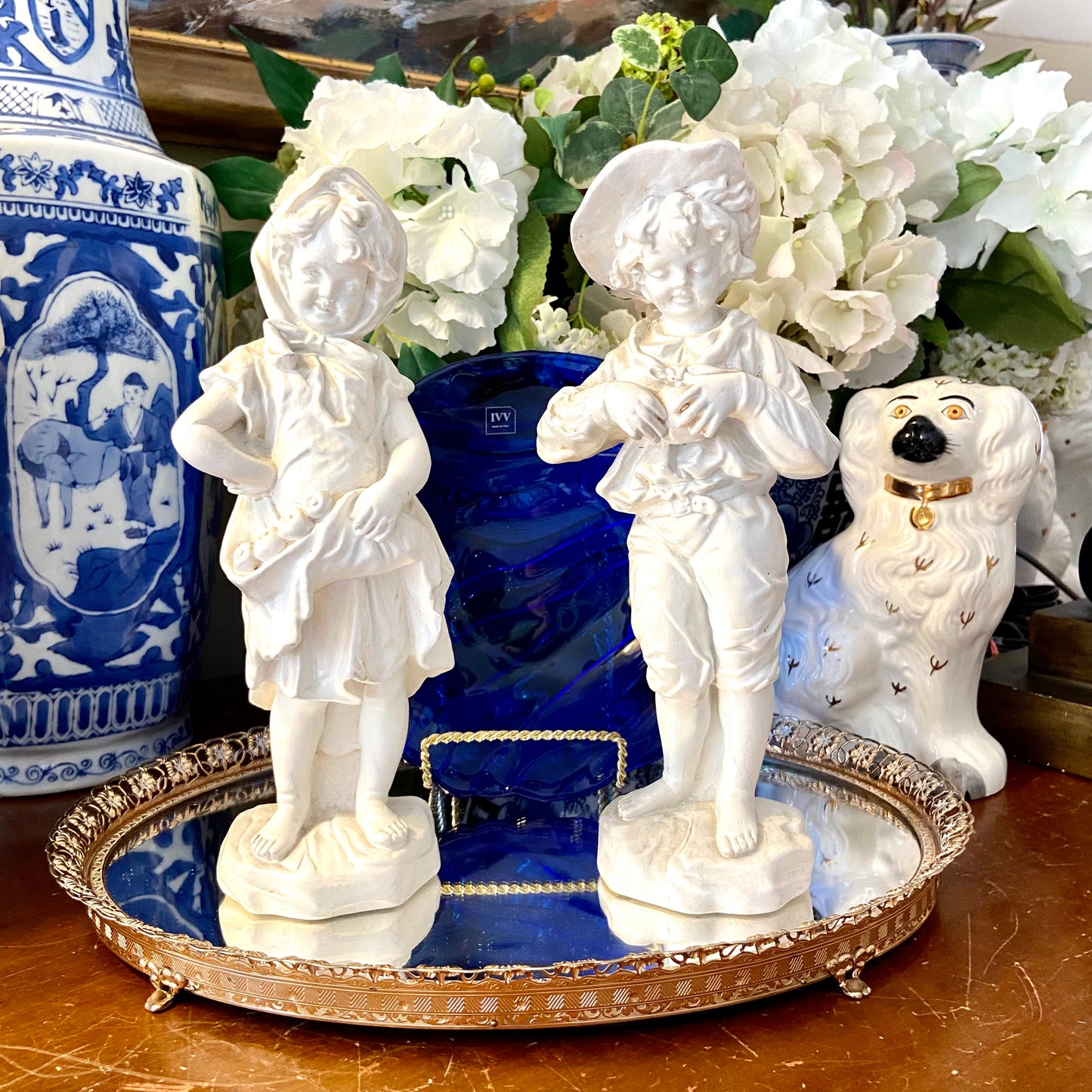 Set of vintage whimsical Girl & Boy statues