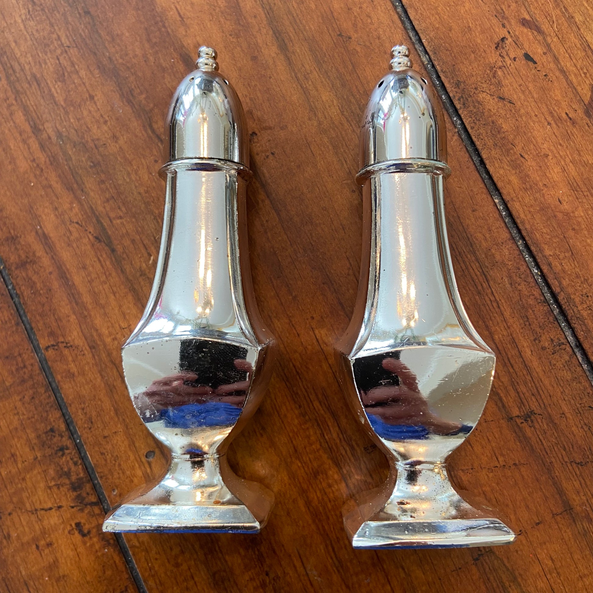 Designer salt and outlet pepper shakers