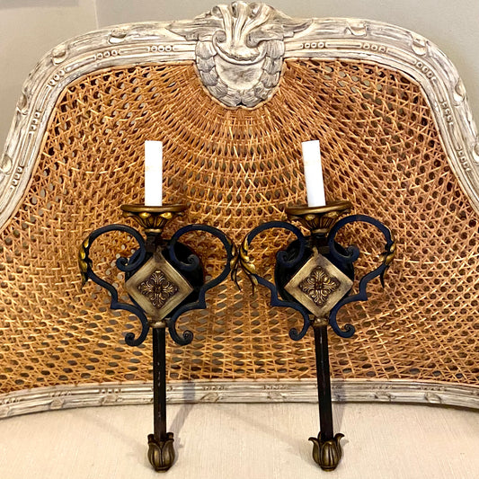 Pair of vintage ebony and gold gilt hardwired wall sconce lighting.