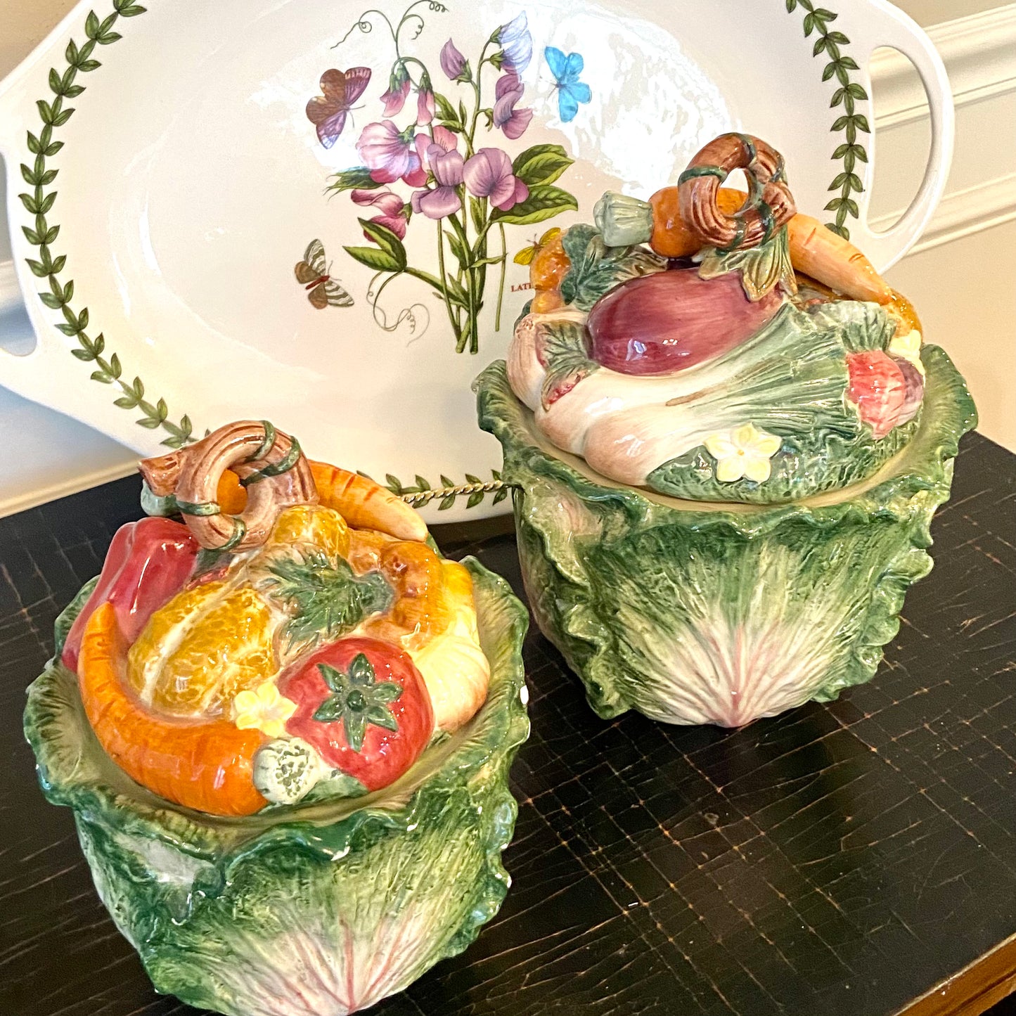 Set of two vintage Fitz & Floyd majolica style cabbage ware jars with lids.