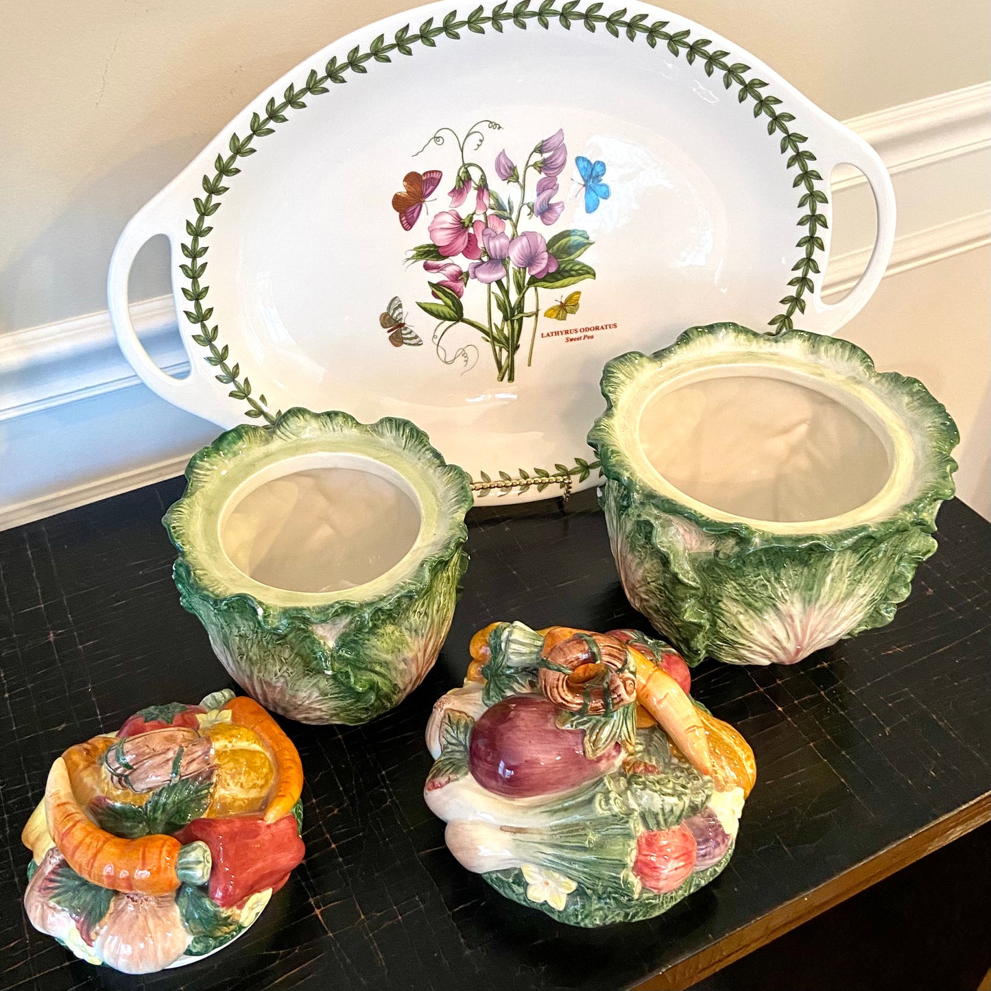 Set of two vintage Fitz & Floyd majolica style cabbage ware jars with lids.
