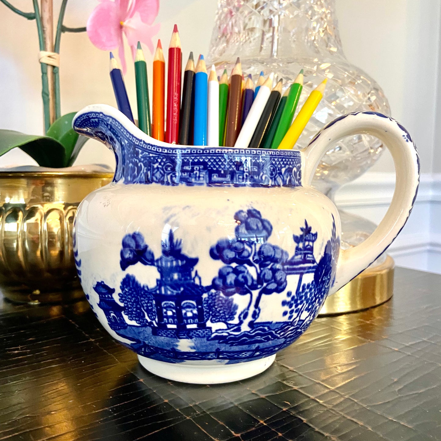 Vintage blue willow blue & white porcelain pitcher.